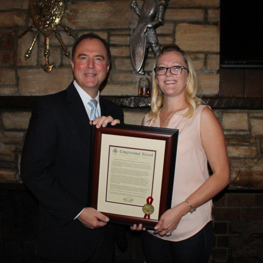 Receiving a Woman of the Year Award from Rep. Adam Schiff